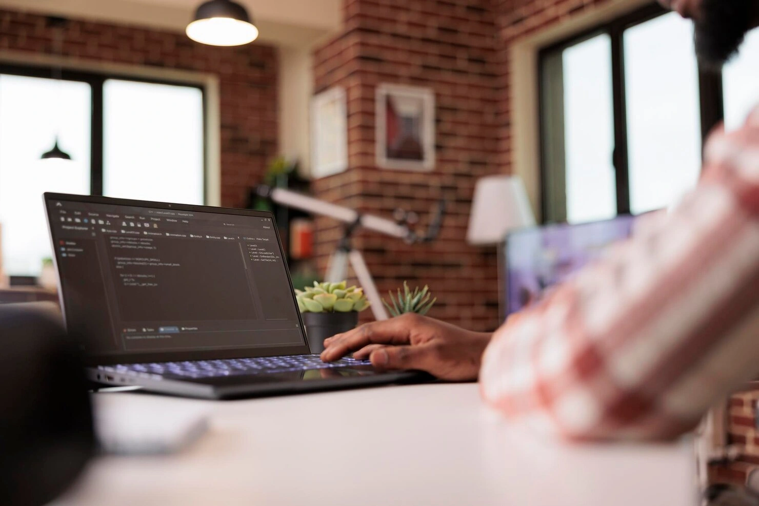 Freelance website development in Chennai workspace with laptop and code editor
